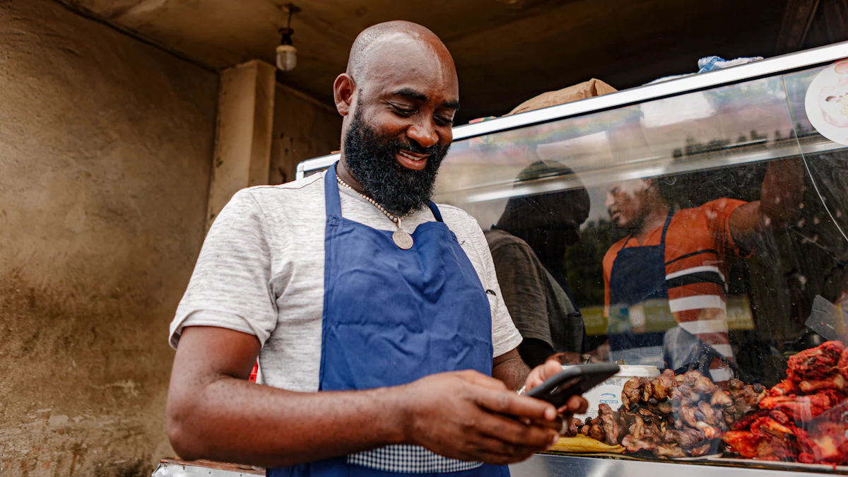 A shop owner in an apron checks a phone behind the counter.