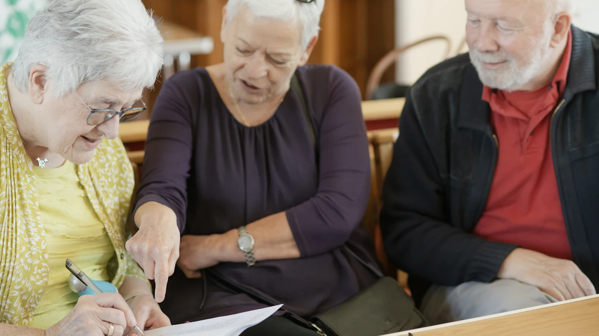 Three older adults look over a document together, one holding a pen.